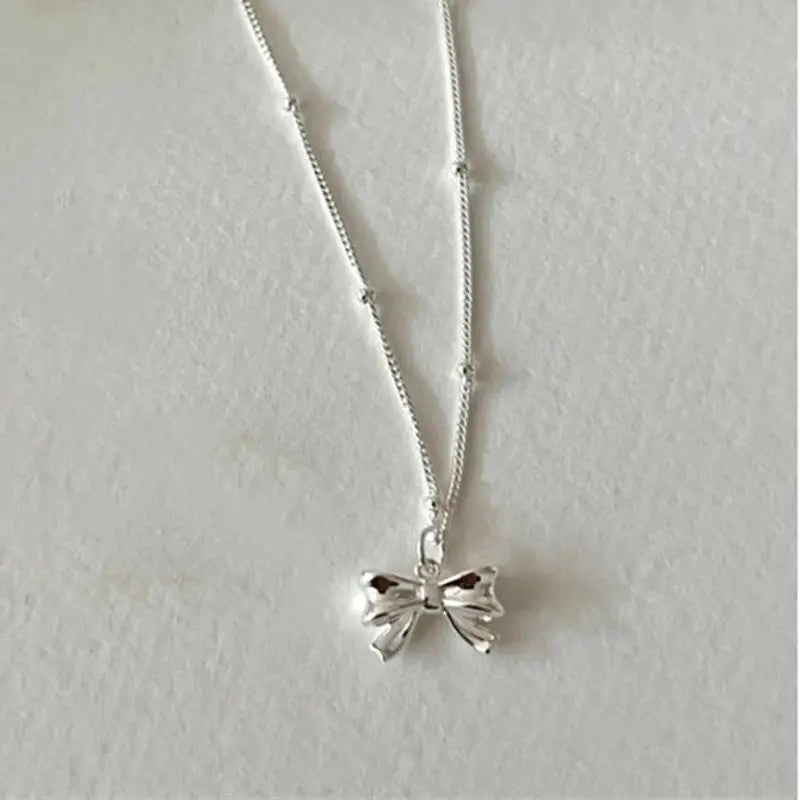 Dainty Bow Tie Bowknot Charm Necklace in Sterling Silver - Silver