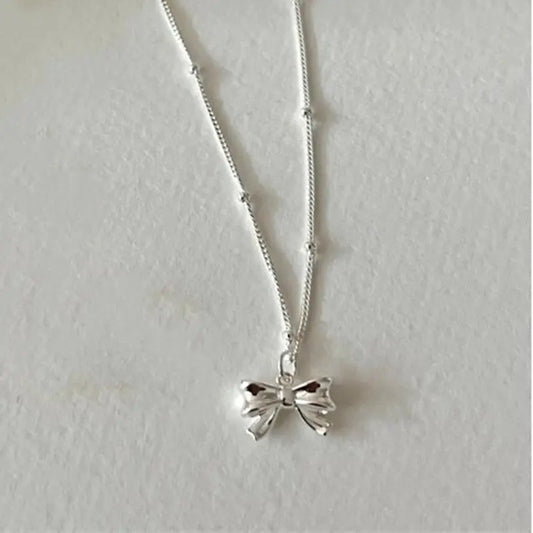 Dainty Bow Tie Bowknot Charm Necklace in Sterling Silver - Silver