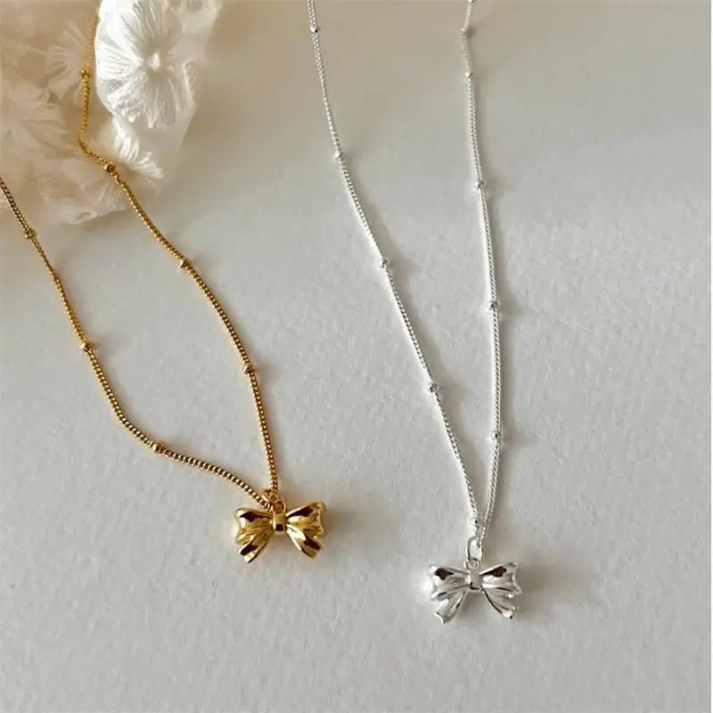 Dainty Bow Tie Bowknot Charm Necklace in Sterling Silver - Silver